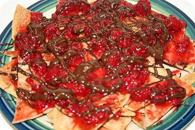 http://www.feedblitz.com/t2.asp?/722502/25930650/4035620/http://feeds.feedblitz.com/~/t/0/0/thekrazycouponlady/~http://thekrazycouponlady.com/2011/06/25/krazy-in-the-kitchen-raspberry-chocolate-nachos/nacho-dessert/