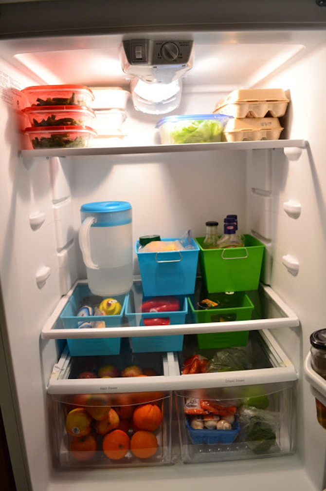 Fridge & Freezer Hack: Organize items into food groups with dollar-store baskets.