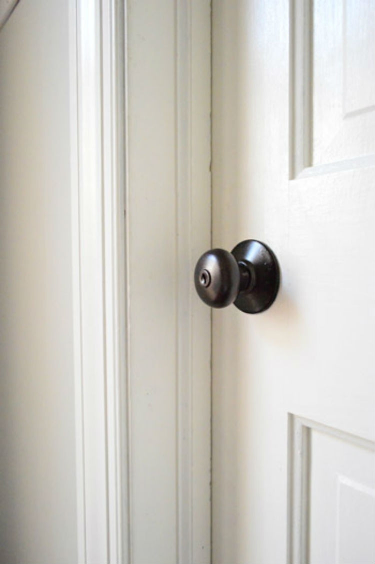 Upgrade old brass door knobs with spray paint.