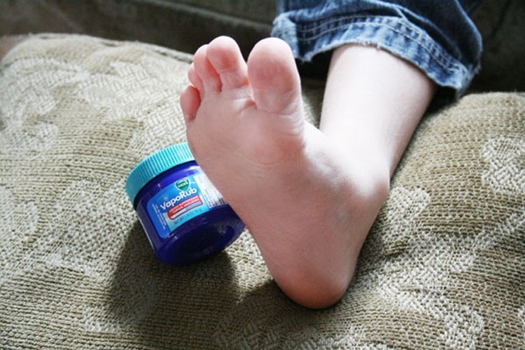 Rub Vicks on the bottom of your feet then put on socks before bed to ease a bad cough.