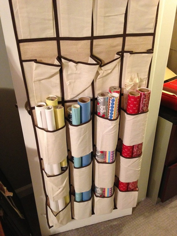 Dollar Store Organizing: Cut the bottoms of shoe organizer pockets to hold wrapping paper.