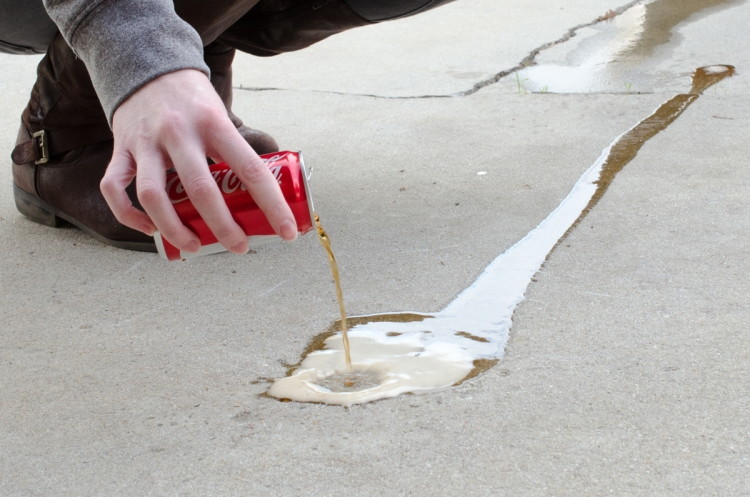 Remove oil stains on concrete.