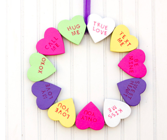 Create a candy heart wreath with paper mache box lids