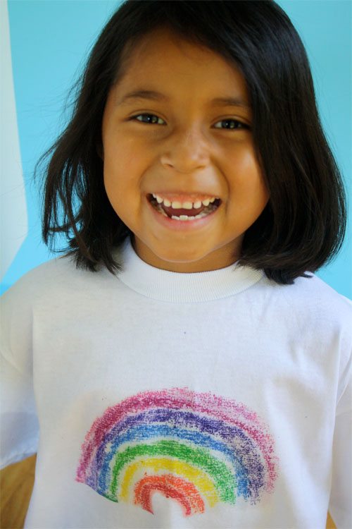 Give your kids crayons and sandpaper to make a custom printed T-shirt.
