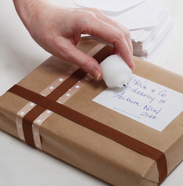 Waterproof a return address, shipping labels and recipe cards with white candle wax.