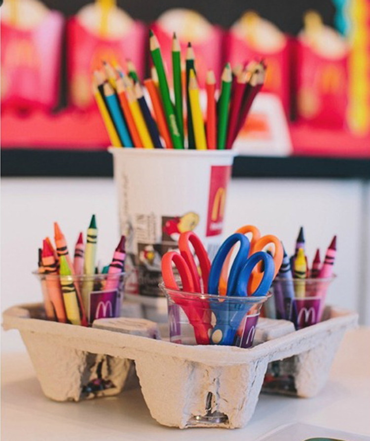 Organize colored pencils and crayons in a fast-food drink carrier.