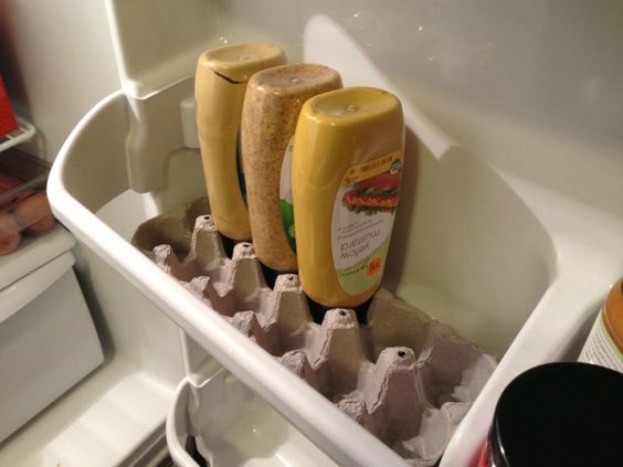 Get the most out of condiments by setting them upside down in an egg carton.
