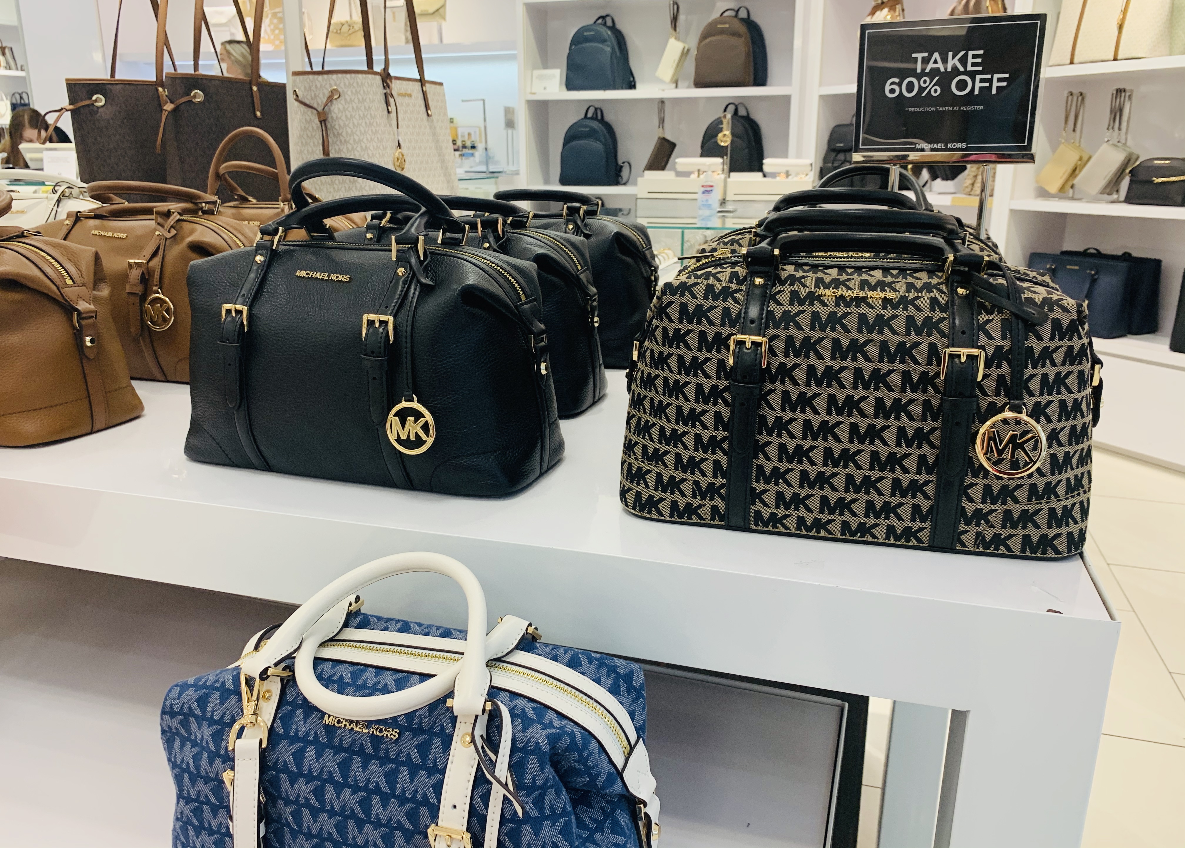 what's the difference between michael kors outlet and store